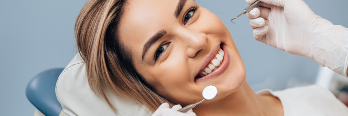 A smiling woman in the dentist’s chair