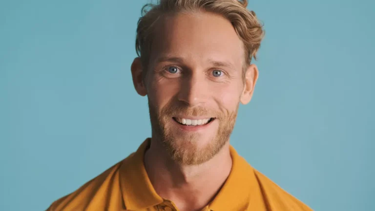 A man with a wide white smile.